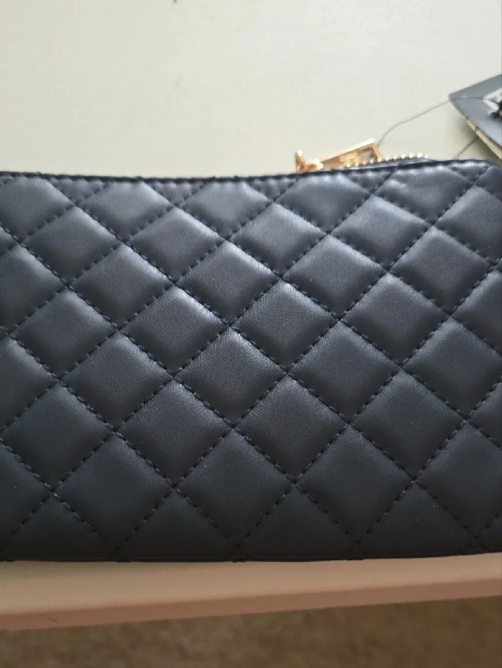 Badgley Mischka Quilted Navy Wristlet with Gold Emblem